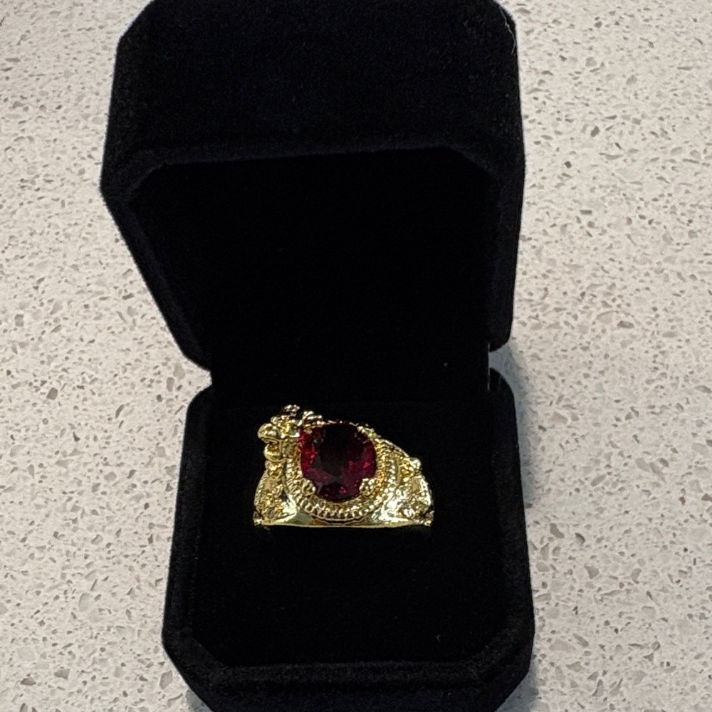 Luxurious Gold tone Ring with Red Gemstone